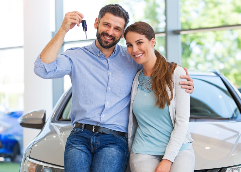 Young couple with car keys
